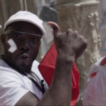 Noble Ackerson, winner of the #ROTBthroughGlass contest celebrates on the balcony of Pamplona's Town Hall at the opening ceremonies of the Running of the Bulls