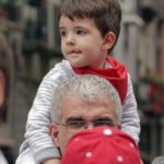 father-son-enjoying-san-fermin-festival-in-pamplona