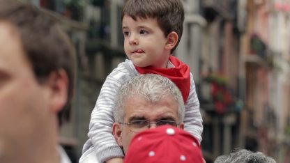 father-son-enjoying-san-fermin-festival-in-pamplona