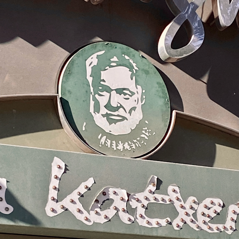 hemingway image on a bar sign in Pamplona